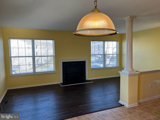 1032 Moore Road Thorofare, NJ 08086 - Photo 18 of 31 an empty room with wooden floor and windows