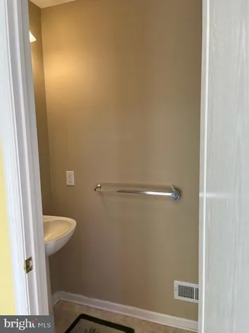 a view of wooden floor and brick walls