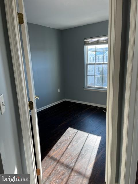 1032 Moore Road Thorofare, NJ 08086 - Photo 21 of 31 an empty room with wooden floor and windows