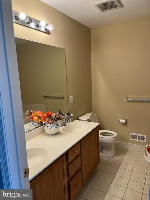 1032 Moore Road Thorofare, NJ 08086 - Photo 26 of 31 a bathroom with a sink a toilet and mirror