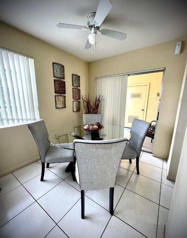 15320 Southwest 106th Terrace, Unit 1108 Miami, FL 33196 - Photo 10 of 19 a living room with furniture and a potted plant