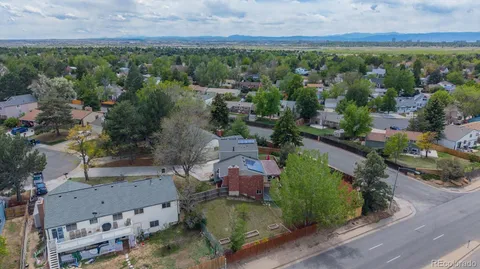 an aerial view of a houses with outdoor space