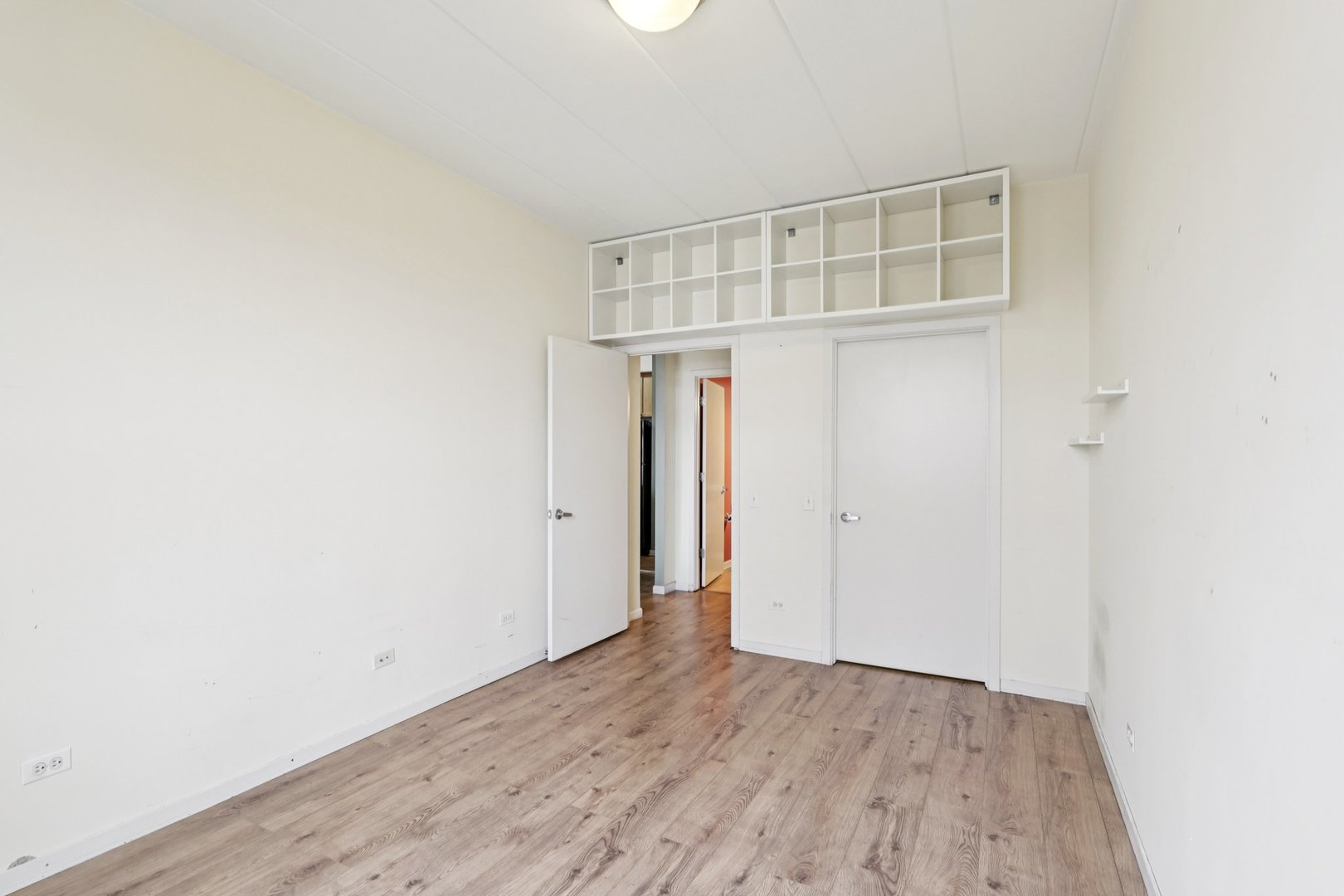 974 West 35th Place, Unit 302 Chicago, IL 60609 - Photo 11 of 22 an empty room with wooden floor and closet