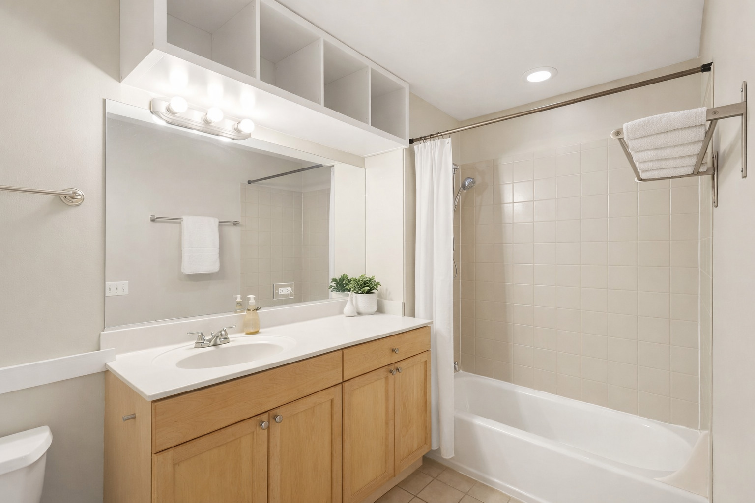 974 West 35th Place, Unit 302 Chicago, IL 60609 - Photo 15 of 22 a bathroom with a bathtub shower sink vanity and mirror