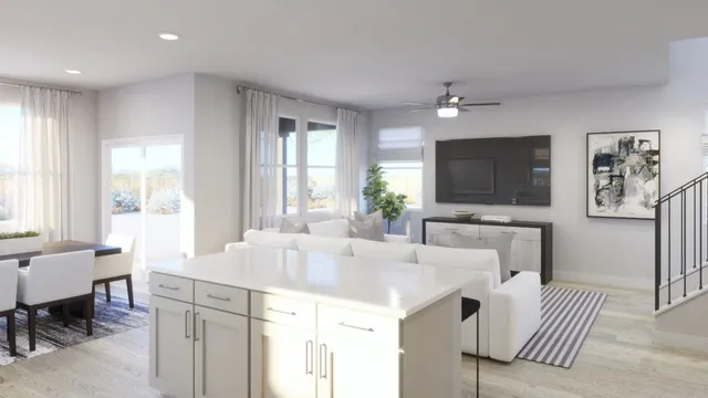 a view of a dining room with a table and chairs