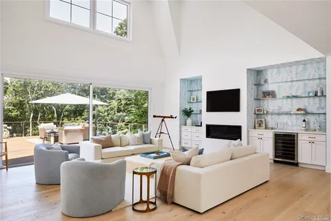 a living room with furniture flat screen tv and a fireplace