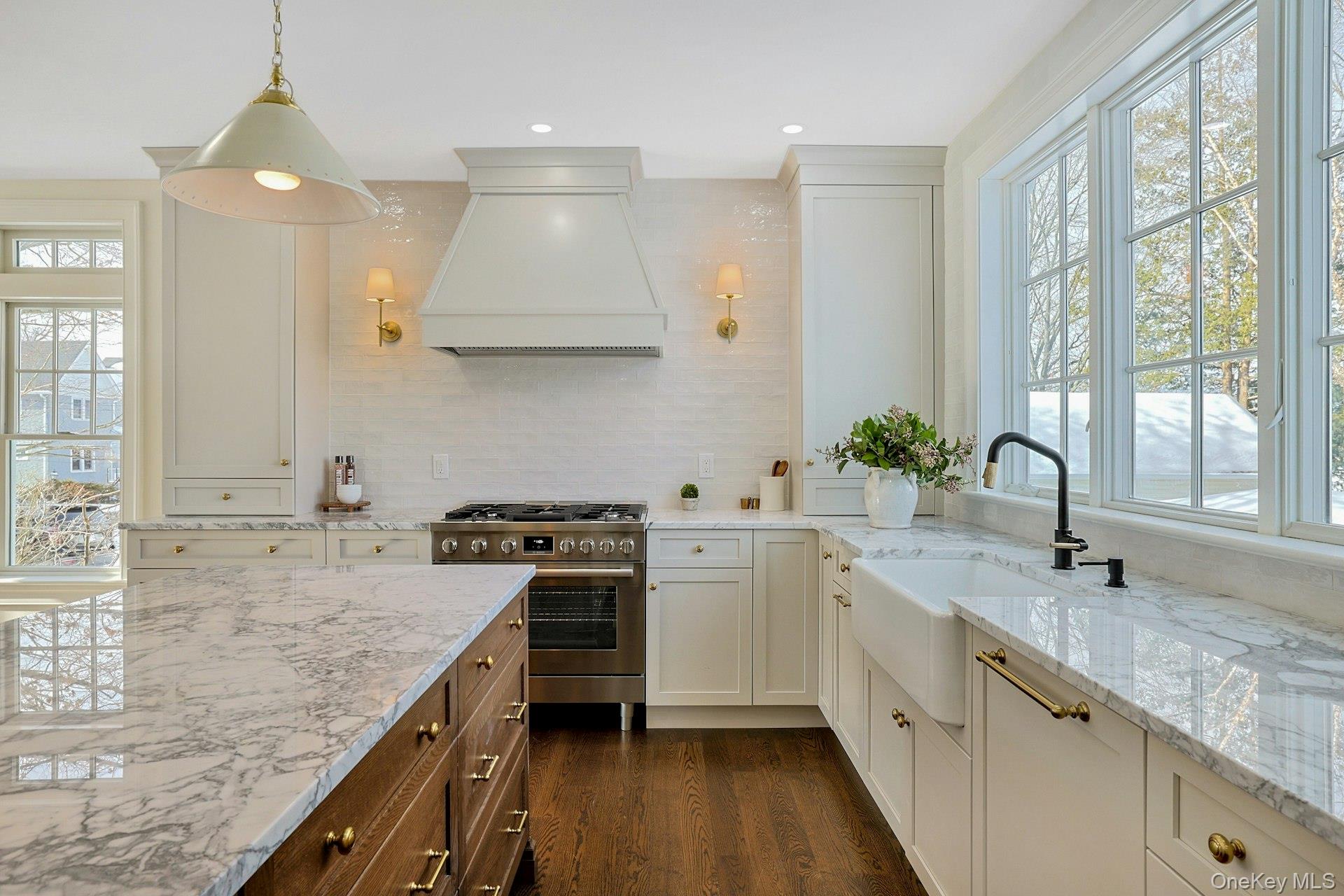 5 Henry Street Tuckahoe, NY 10707 - Photo 9 of 34 Hutch cabinets frame your beautiful new range and custom hood. Designer sconces complete the look for this elevated kitchen.