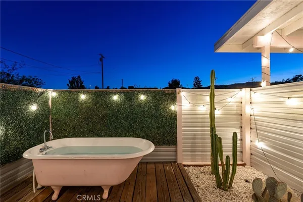 a view of a swimming pool with a patio