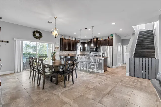 a kitchen with stainless steel appliances granite countertop a sink stove and microwave