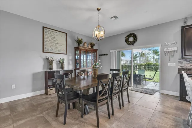 a bathroom with a granite countertop toilet sink and a mirror
