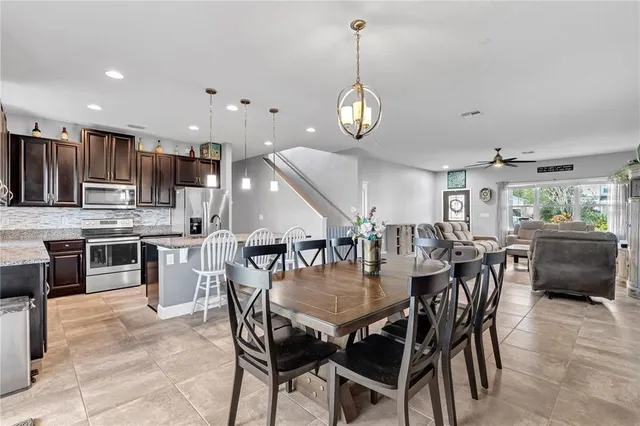 a view of a patio with a table and chairs