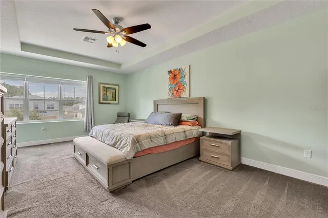 an aerial view of a house with a lake view