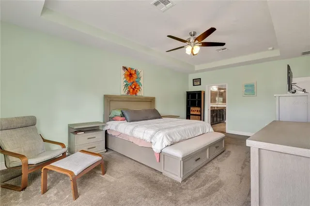 an aerial view of a house with a swimming pool yard and outdoor seating