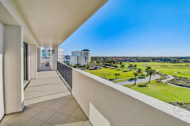 a view of swimming pool from a balcony