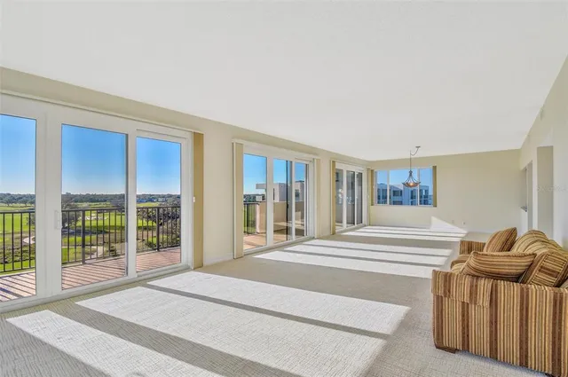 a spacious bedroom with a large bed and a large window