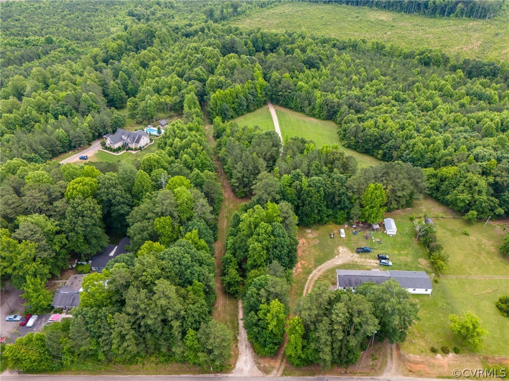 6009 Tranquility Lane Sutherland, VA 23885 - Photo 4 of 7 an aerial view of a house with a yard and lake view
