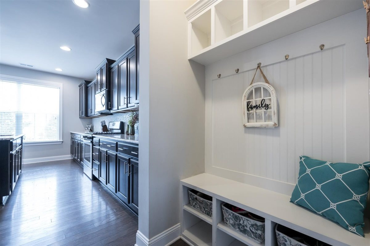 409 Morgan Ridge Road Holly Springs, NC 27540 - Photo 14 of 30 Functional mudroom off garage entrance features storage and bench for the perfect dropzone. Walk-in pantry directly across from this space Mudroom