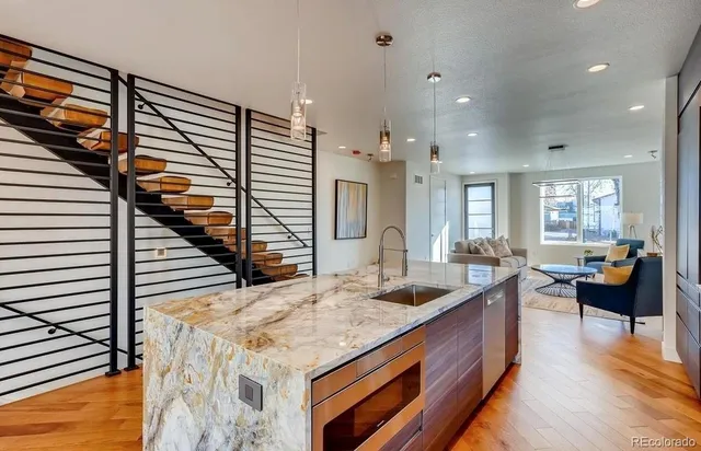 a kitchen with sink and stove