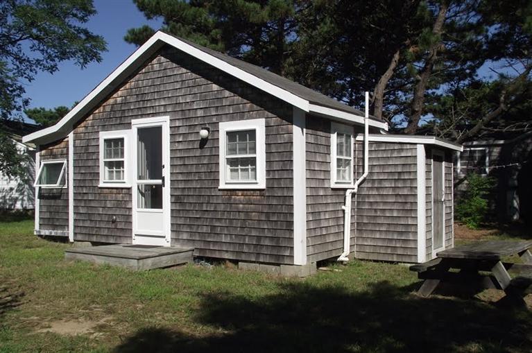 125 Shore Road, Unit 11 Truro, MA 02666 - Photo 1 of 8 a front view of a house with a garden