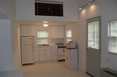 125 Shore Road, Unit 11 Truro, MA 02666 - Photo 2 of 8 a kitchen with sink cabinets and window