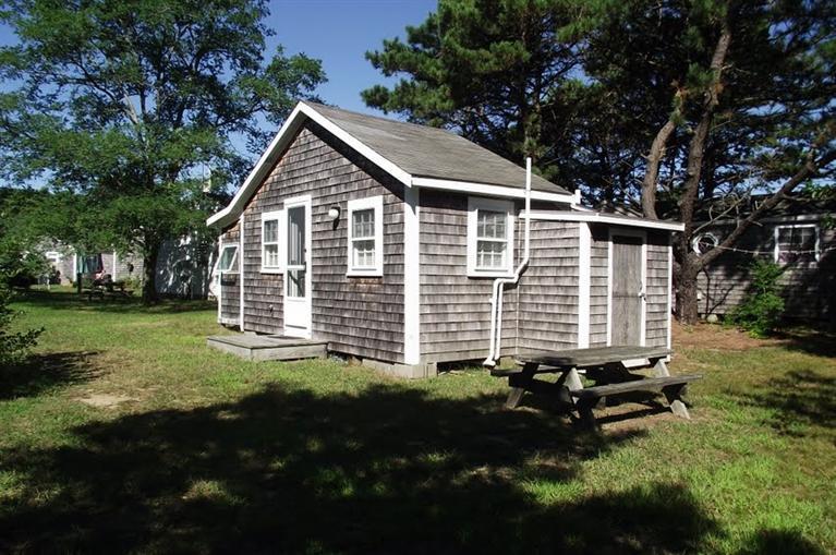125 Shore Road, Unit 11 Truro, MA 02666 - Photo 5 of 8 a backyard of a house with lots of green space