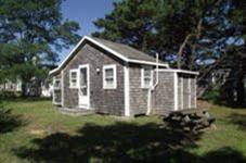 125 Shore Road, Unit 11 Truro, MA 02666 - Photo 7 of 8 a view of a house with backyard and garden