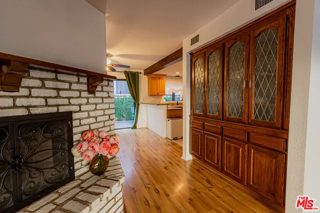 a kitchen with wooden cabinets and a stove top oven