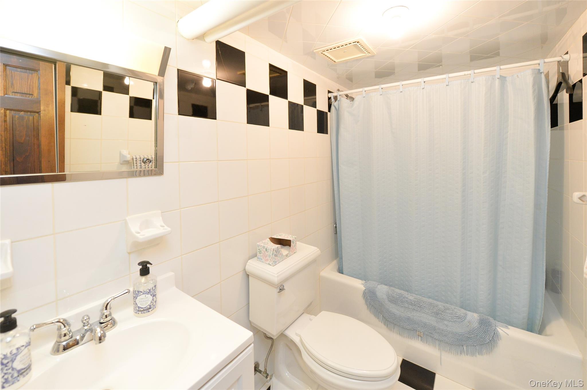24 Highview Road Monsey, NY 10952 - Photo 37 of 44 a white toilet sitting next to a bathroom sink