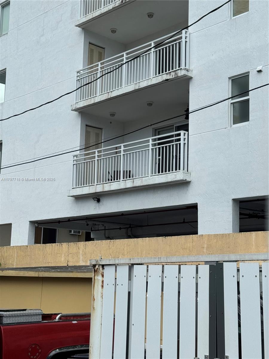 498 Southwest 2nd Street, Unit 2D Miami, FL 33130 - Photo 12 of 35 a view of a house with wooden deck