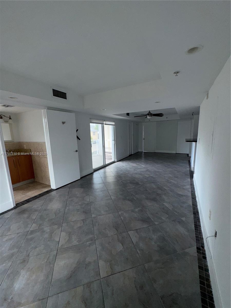498 Southwest 2nd Street, Unit 2D Miami, FL 33130 - Photo 14 of 35 a view of an empty room with a kitchen