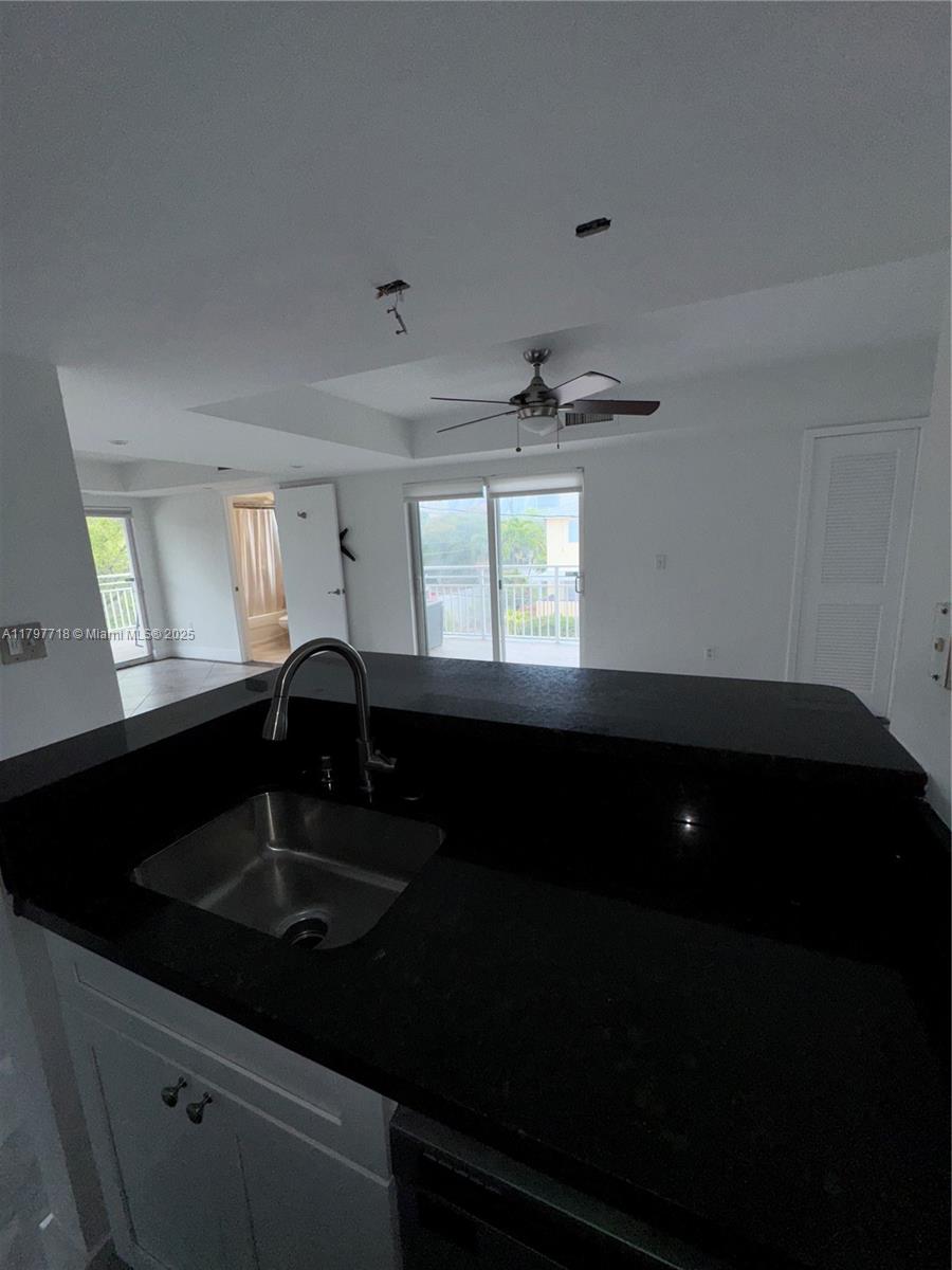 498 Southwest 2nd Street, Unit 2D Miami, FL 33130 - Photo 20 of 35 a kitchen that has a sink cabinets and window