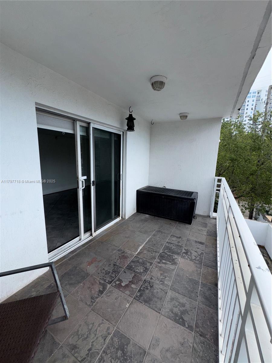 498 Southwest 2nd Street, Unit 2D Miami, FL 33130 - Photo 23 of 35 a large bedroom with a bed and a window