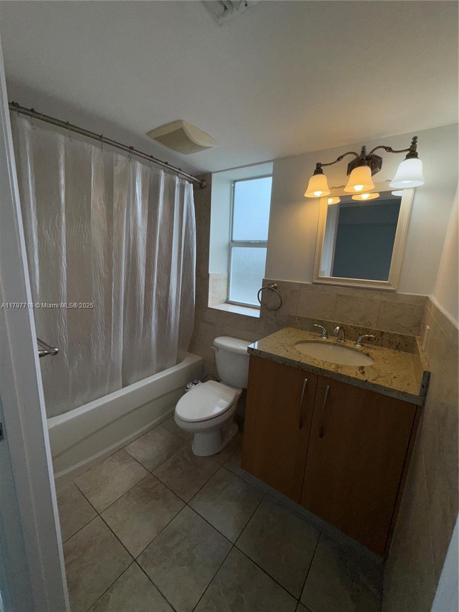 498 Southwest 2nd Street, Unit 2D Miami, FL 33130 - Photo 24 of 35 a bathroom with a toilet and a sink