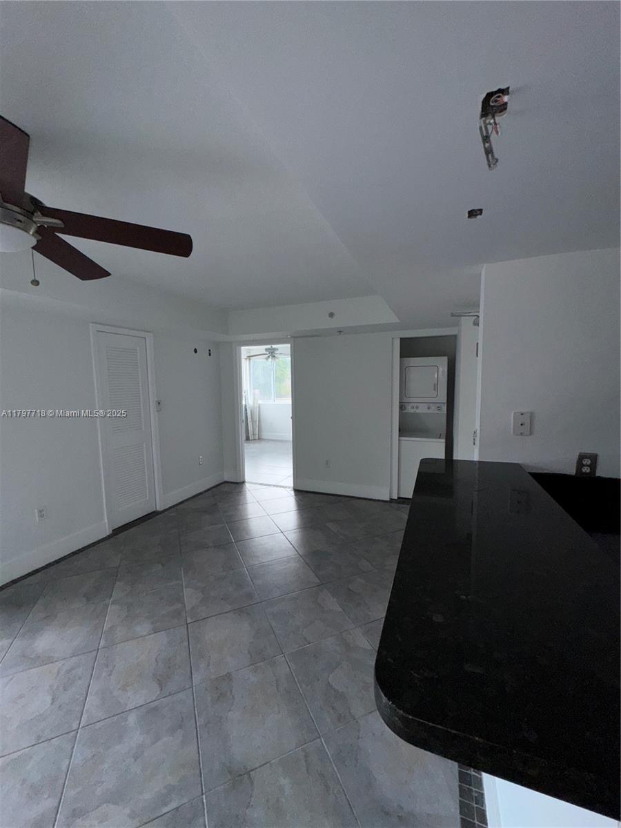 498 Southwest 2nd Street, Unit 2D Miami, FL 33130 - Photo 25 of 35 a living room with furniture and a ceiling fan