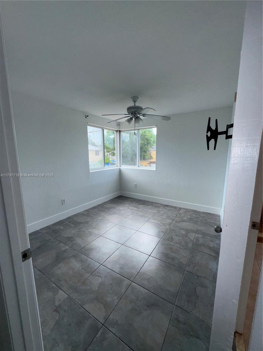 498 Southwest 2nd Street, Unit 2D Miami, FL 33130 - Photo 27 of 35 a view of an empty room and window