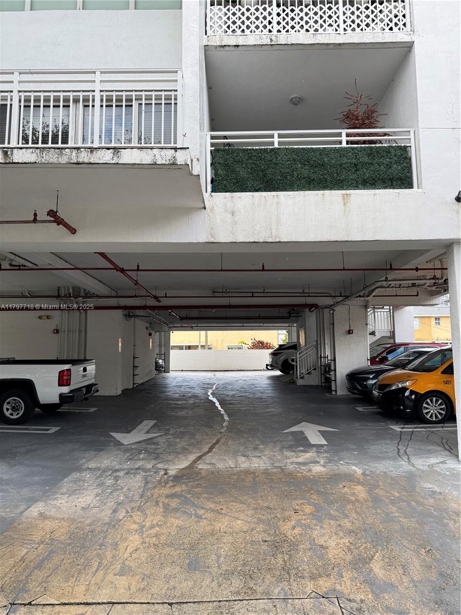 498 Southwest 2nd Street, Unit 2D Miami, FL 33130 - Photo 10 of 35 a view of parking garage with cars