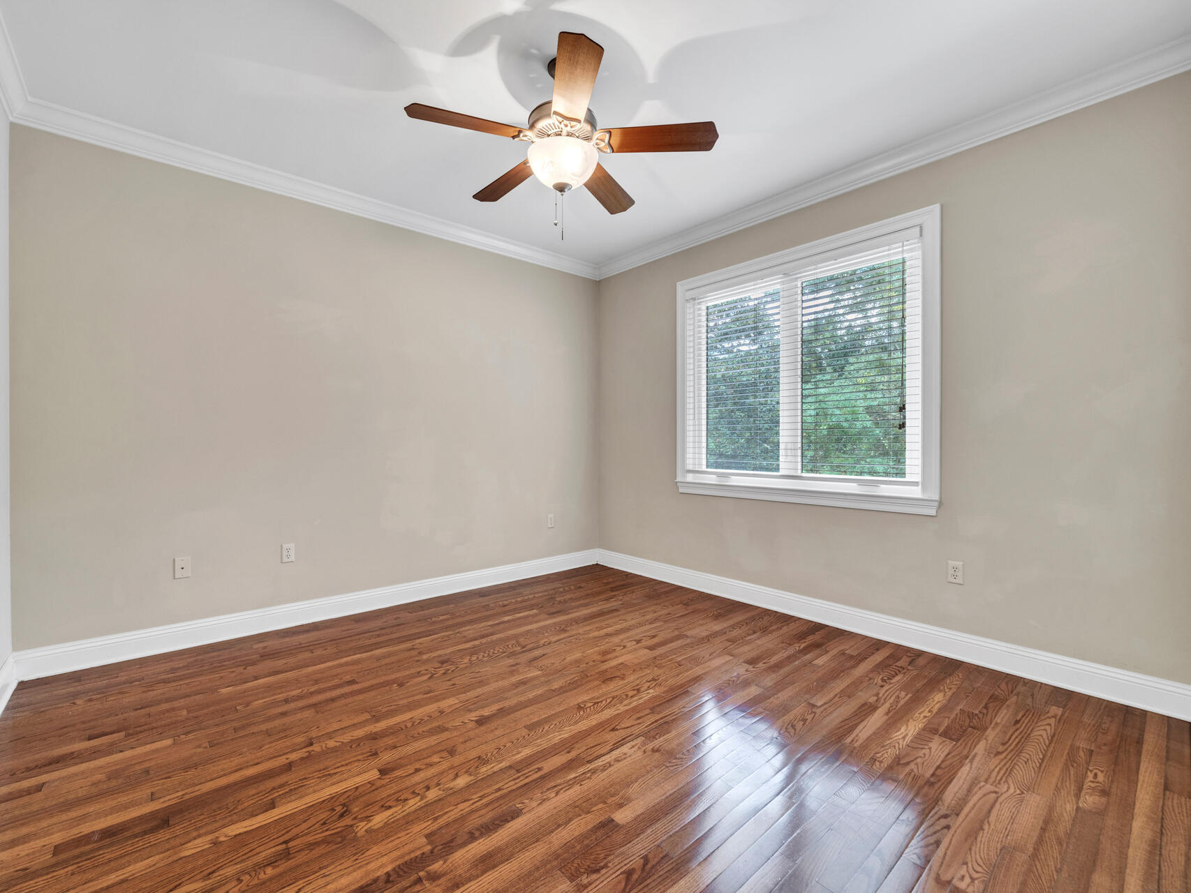 145 Mulry Drive Niceville, FL 32578 - Photo 38 of 58 a view of an empty room with wooden floor and a window