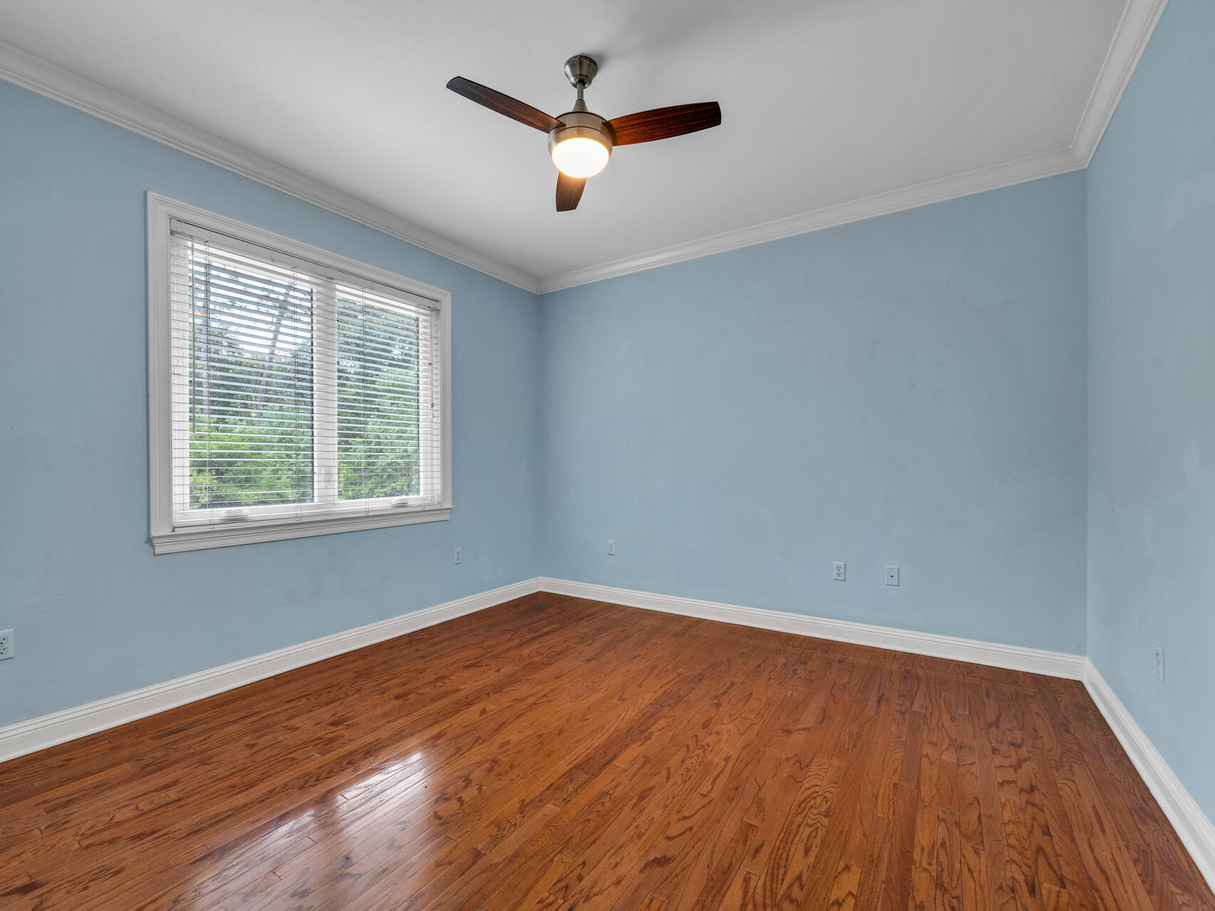 145 Mulry Drive Niceville, FL 32578 - Photo 40 of 58 an empty room with wooden floor and windows