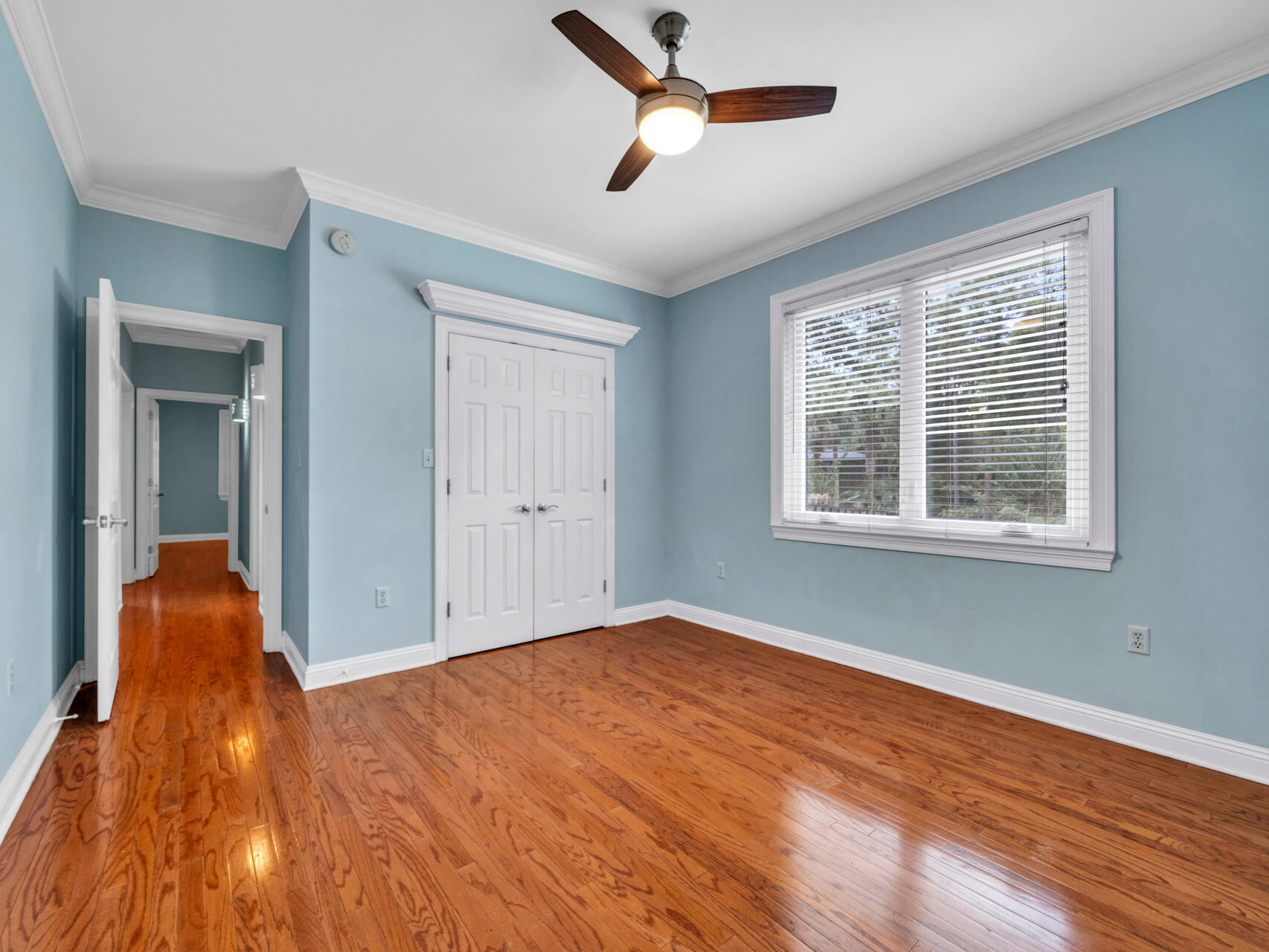 145 Mulry Drive Niceville, FL 32578 - Photo 41 of 58 a view of empty room with wooden floor and fan