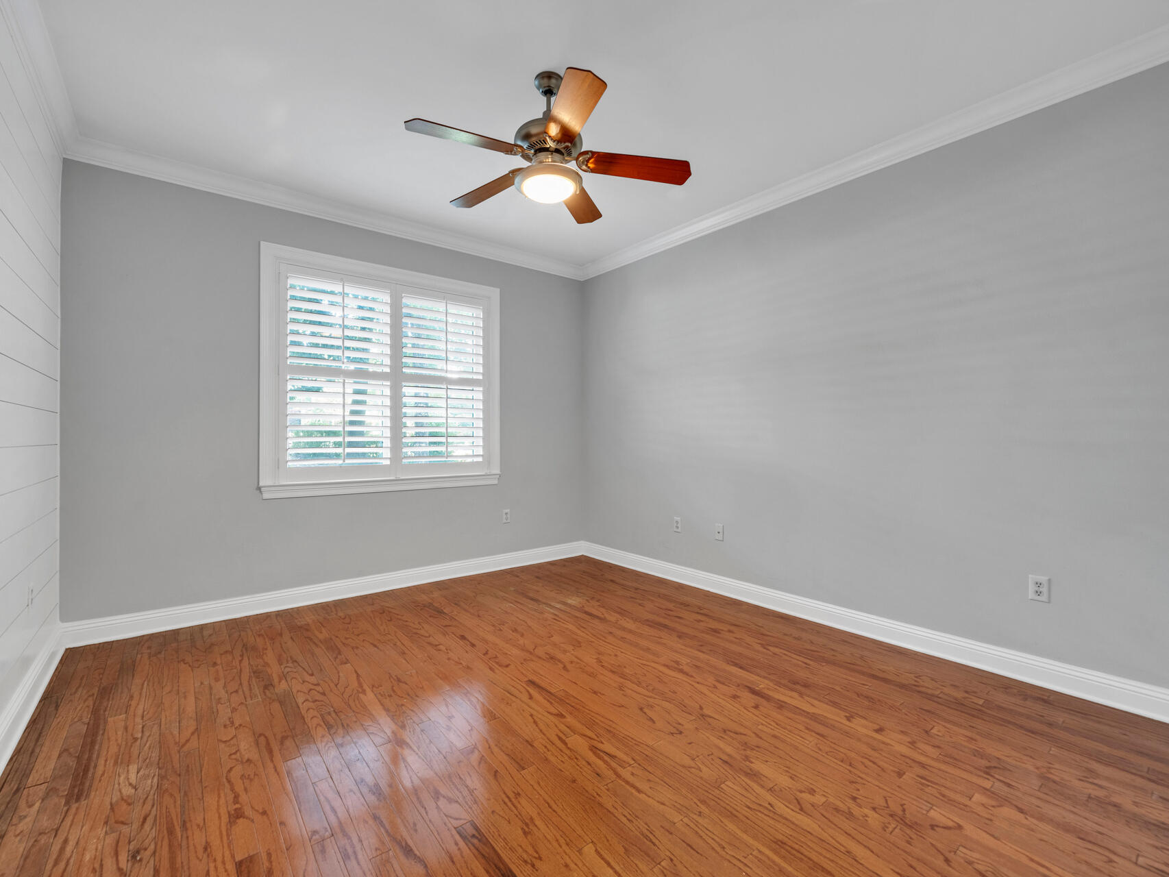 145 Mulry Drive Niceville, FL 32578 - Photo 42 of 58 wooden floor in an empty room with a window