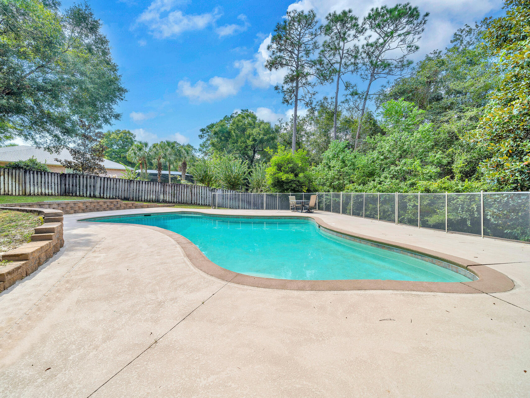 145 Mulry Drive Niceville, FL 32578 - Photo 50 of 58 a view of a swimming pool with a backyard