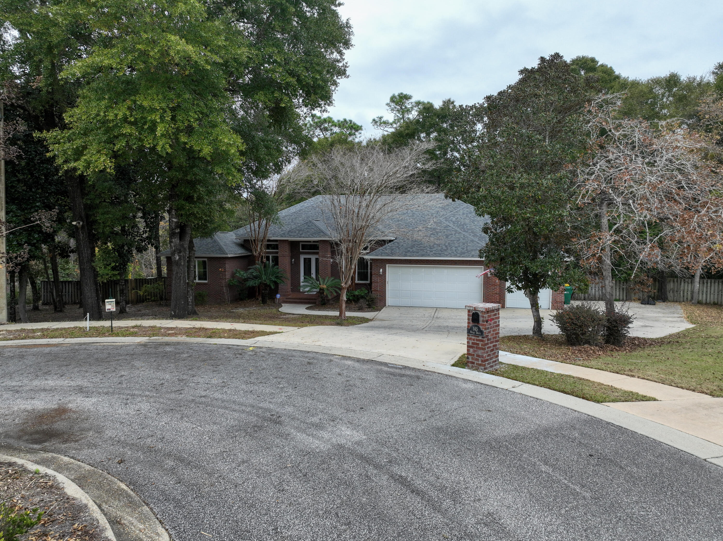 145 Mulry Drive Niceville, FL 32578 - Photo 56 of 58 a view of a house with a yard and large tree