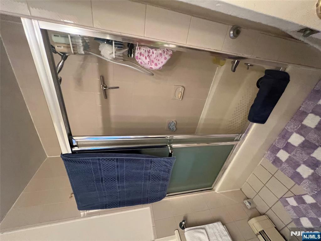 26 Wayne Street Montvale, NJ 07645 - Photo 29 of 32 a bathroom with a shower and a sink