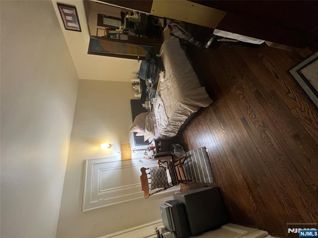 26 Wayne Street Montvale, NJ 07645 - Photo 32 of 32 a bedroom with bed and wooden floor