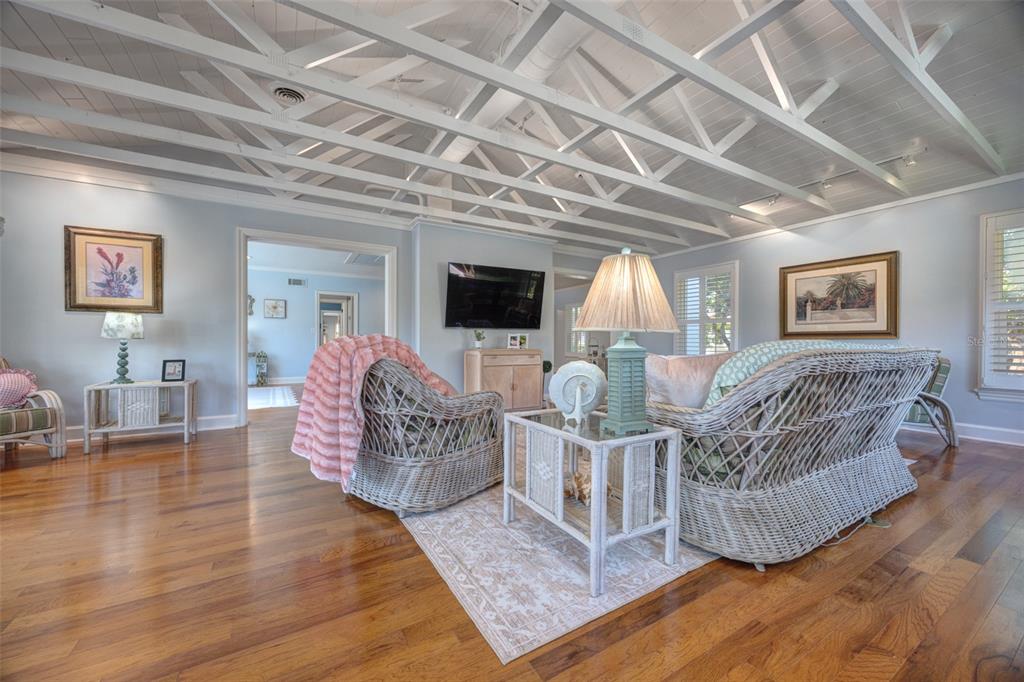 105 Riverside Drive Ormond Beach, FL 32176 - Photo 28 of 100 a living room with furniture and a chandelier
