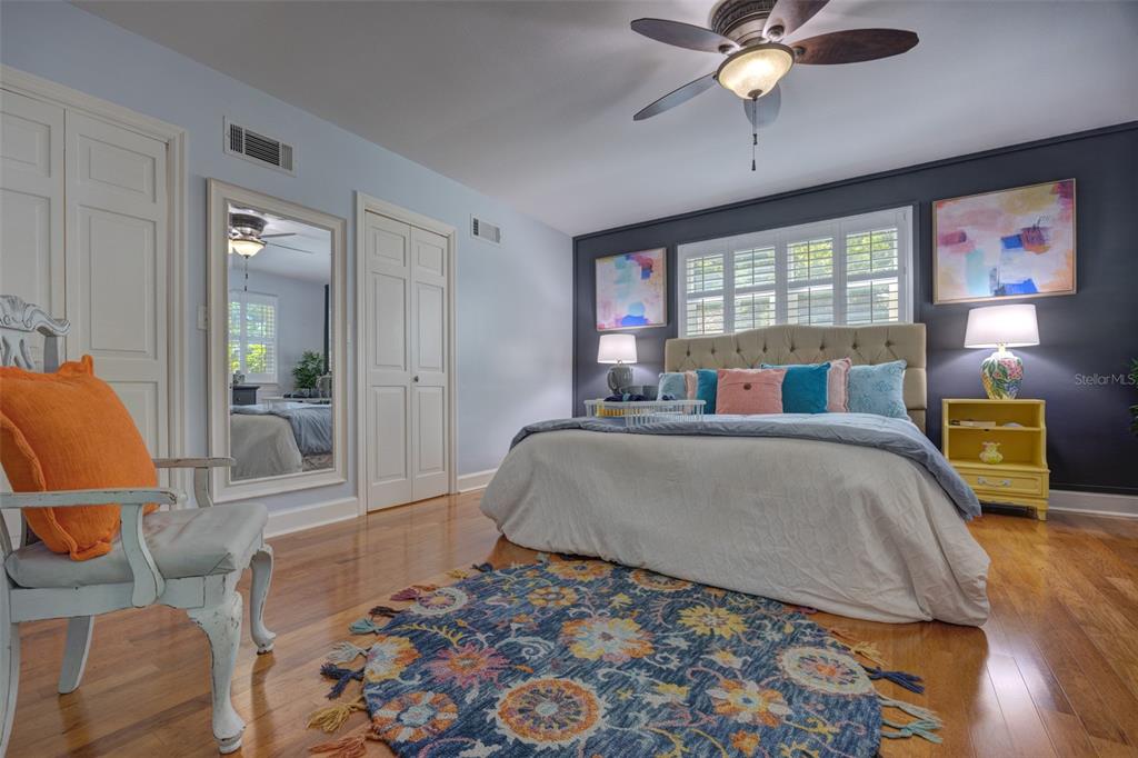 105 Riverside Drive Ormond Beach, FL 32176 - Photo 42 of 100 a bedroom with a bed and wooden floor
