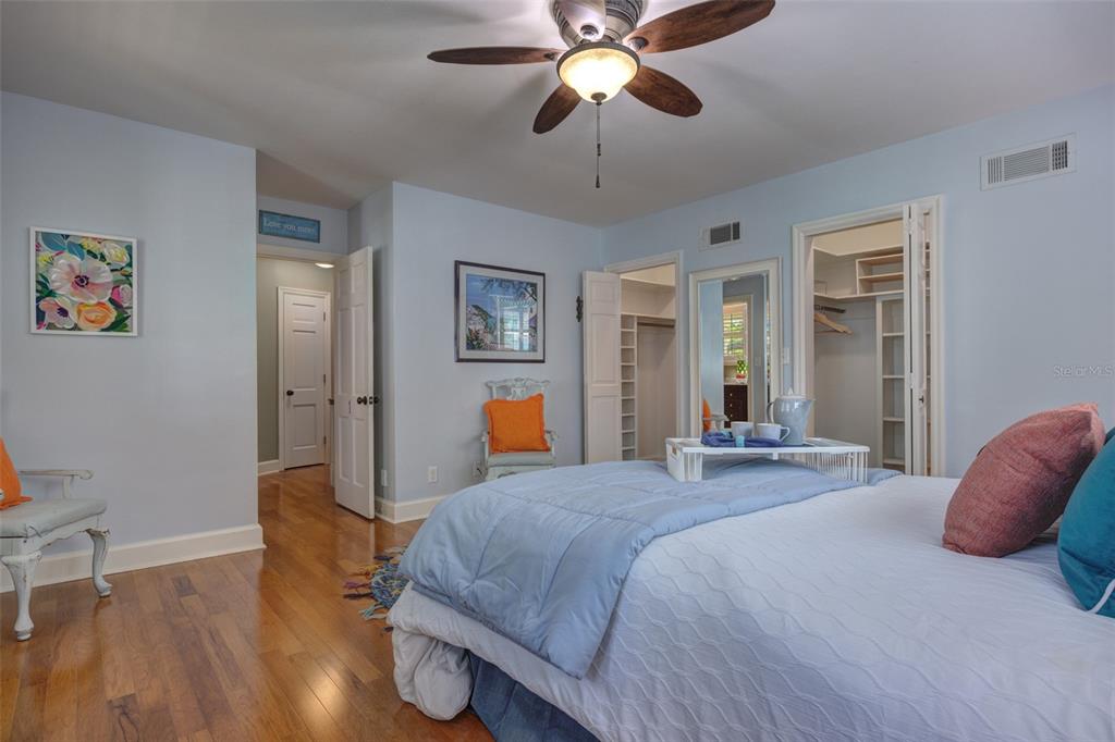 105 Riverside Drive Ormond Beach, FL 32176 - Photo 45 of 100 a bedroom with a bed and wooden floor
