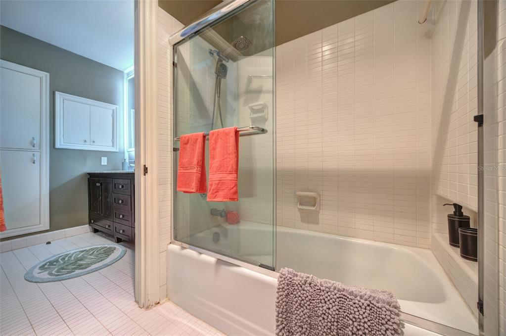 105 Riverside Drive Ormond Beach, FL 32176 - Photo 48 of 100 a bathroom with a tub and a shower