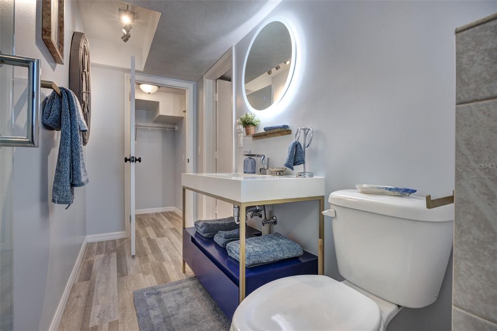 105 Riverside Drive Ormond Beach, FL 32176 - Photo 76 of 100 a bathroom with a toilet a sink and a mirror