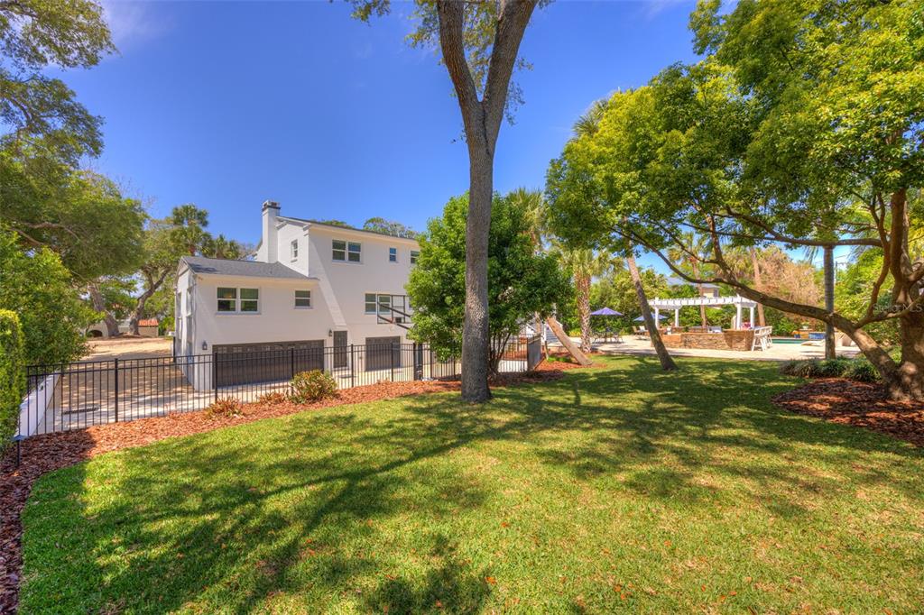 105 Riverside Drive Ormond Beach, FL 32176 - Photo 85 of 100 a view of a house with a big yard